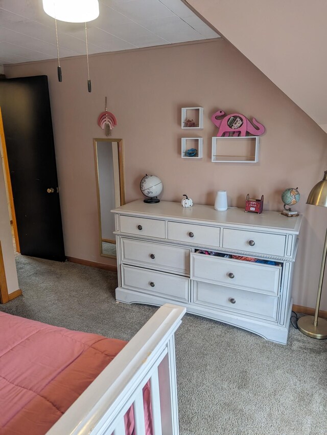 carpeted bedroom featuring lofted ceiling