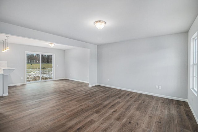 spare room featuring dark hardwood / wood-style flooring