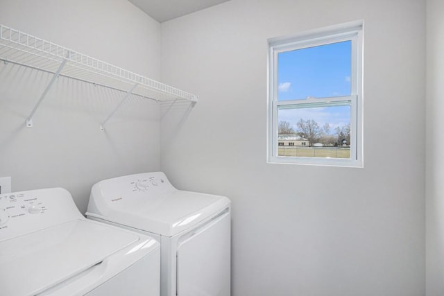 laundry area with washing machine and dryer