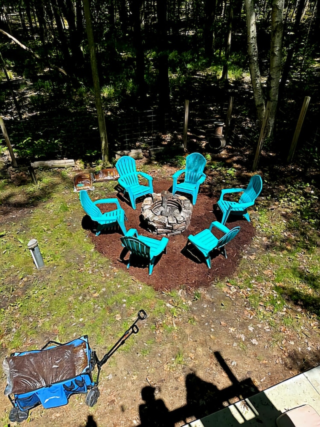 view of yard with a fire pit