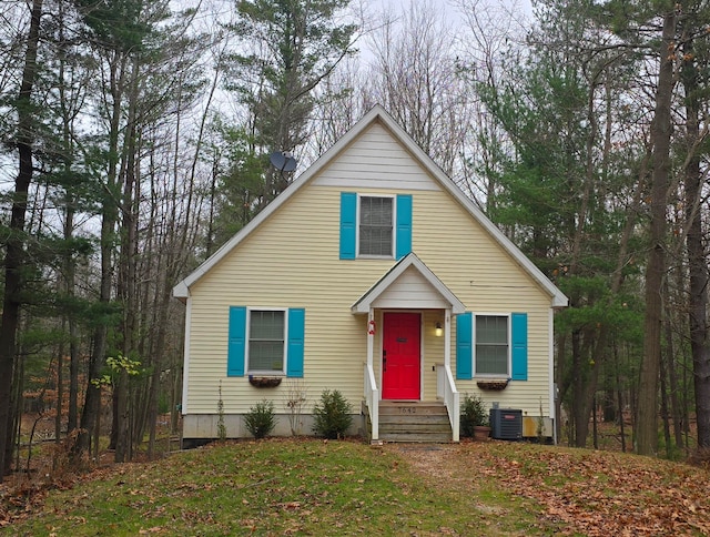 bungalow-style house featuring central AC unit