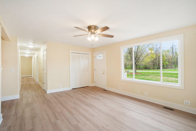 interior space featuring ceiling fan and light wood-type flooring