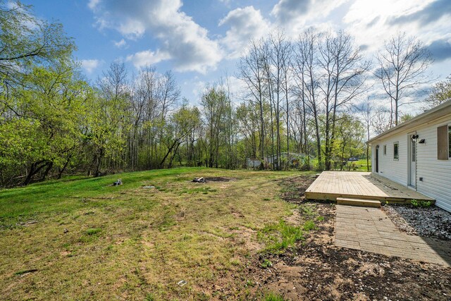 view of yard with a wooden deck