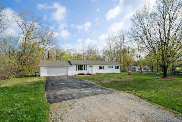 view of front of house with a front lawn and a garage