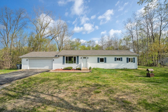 ranch-style house featuring a front lawn and a garage