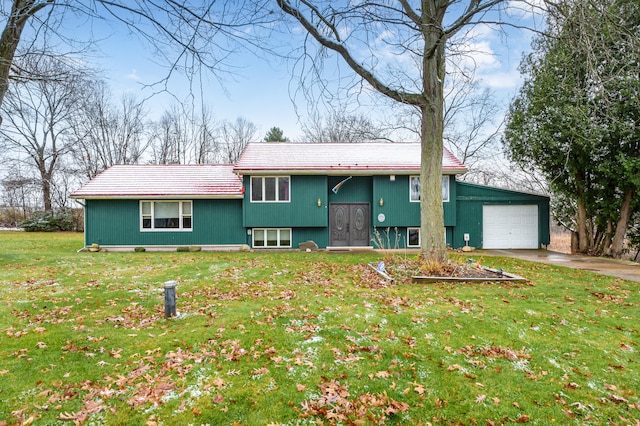 view of front of house with a garage and a front yard