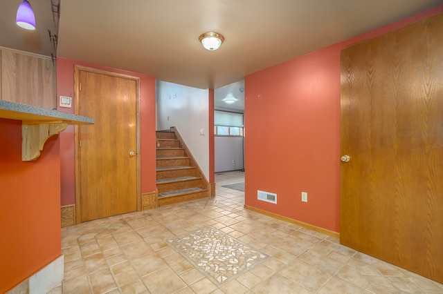 interior space featuring light tile patterned floors