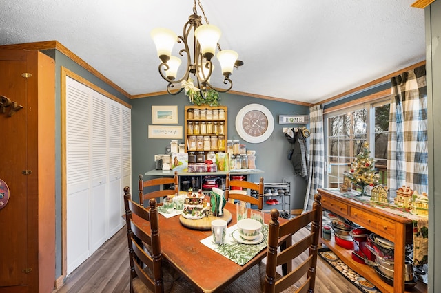 dining area with ornamental molding, dark hardwood / wood-style floors, vaulted ceiling, and a notable chandelier