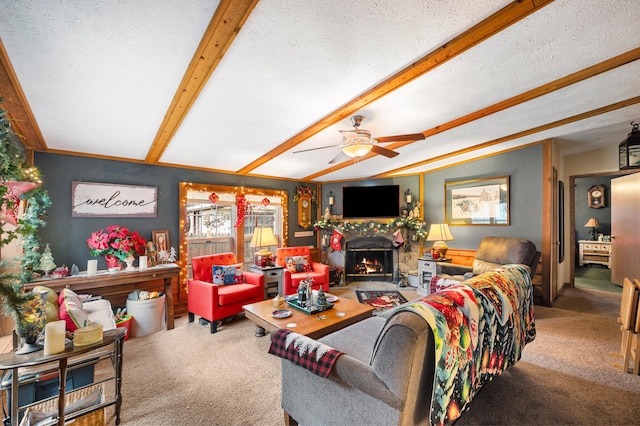 living room featuring vaulted ceiling with beams, ceiling fan, carpet floors, and a textured ceiling