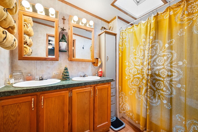 bathroom with vanity and ornamental molding