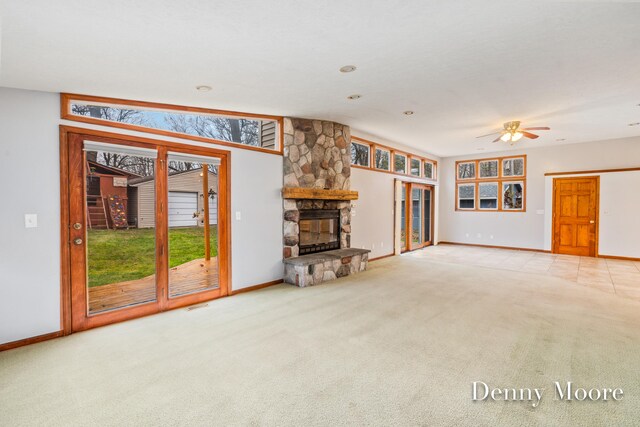 unfurnished living room with a fireplace and carpet flooring