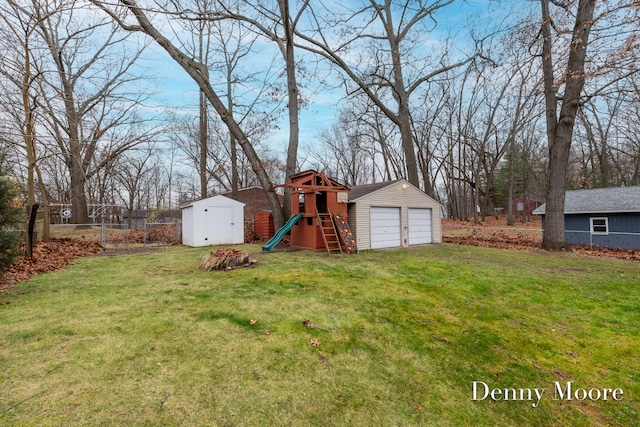 view of yard featuring a playground and an outdoor structure