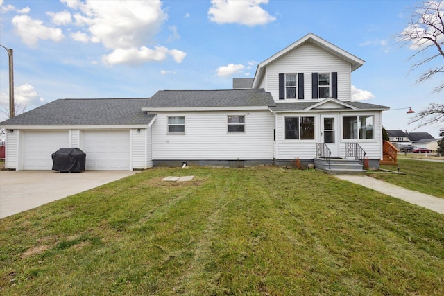 view of front of house with a garage and a front lawn