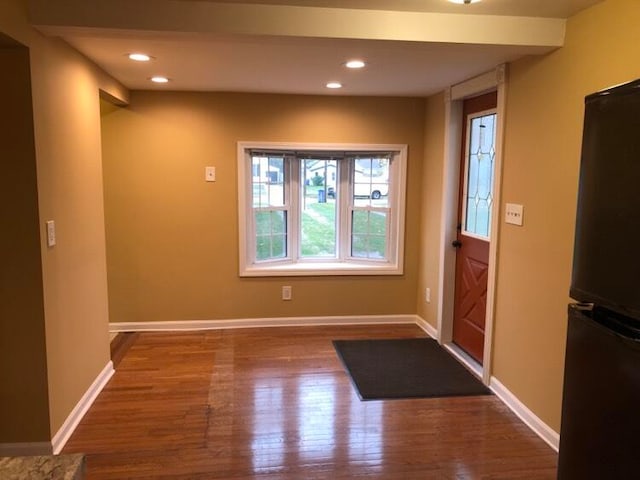 entrance foyer with dark hardwood / wood-style floors