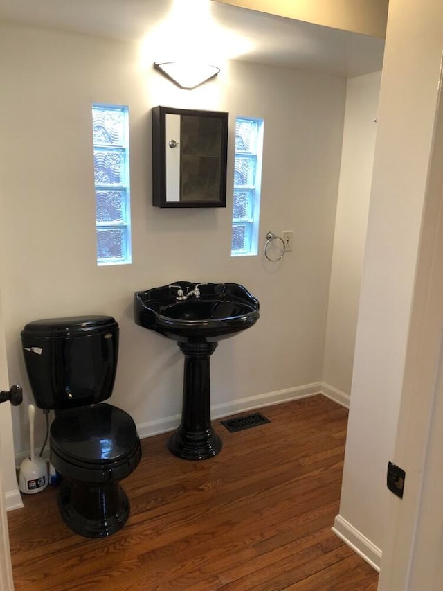 bathroom with hardwood / wood-style flooring