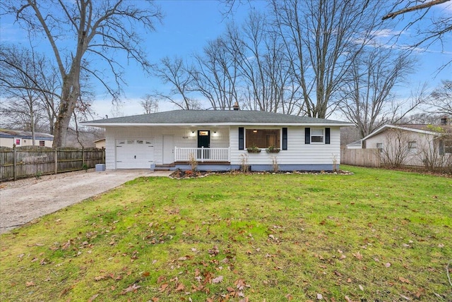 ranch-style house featuring covered porch, a front yard, and a garage