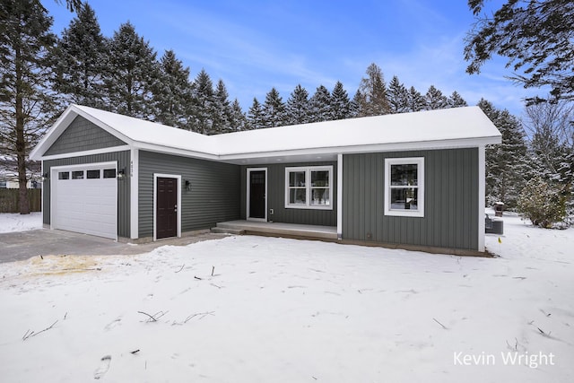 ranch-style home featuring a garage