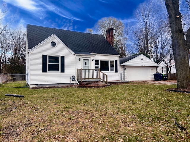 view of front of house with a garage and a front lawn