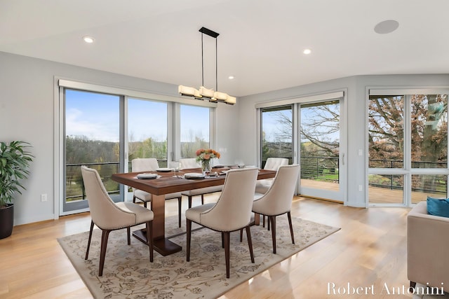 dining area featuring a chandelier and light hardwood / wood-style floors