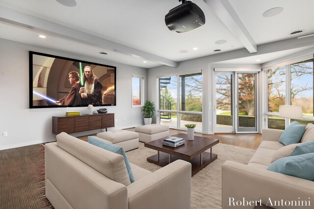 home theater with beam ceiling and hardwood / wood-style floors