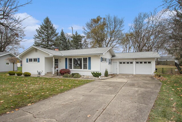 ranch-style house with a front yard and a garage