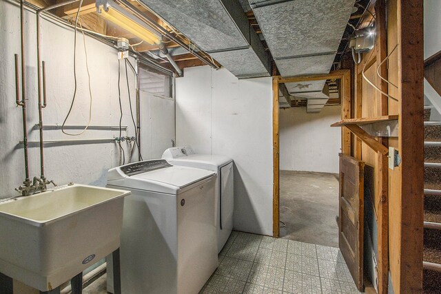 laundry area featuring separate washer and dryer and sink