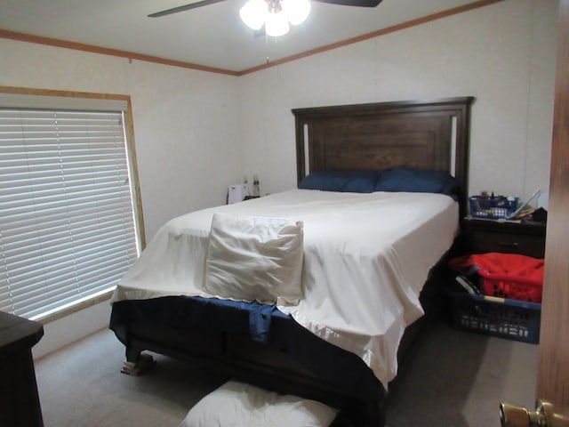 bedroom with ceiling fan, carpet floors, and crown molding