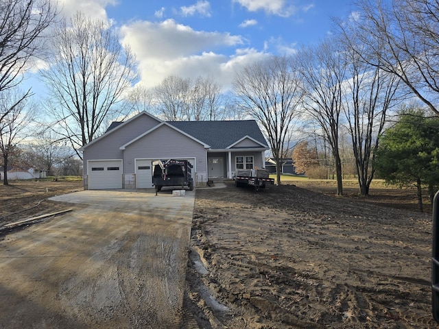 ranch-style home featuring a garage