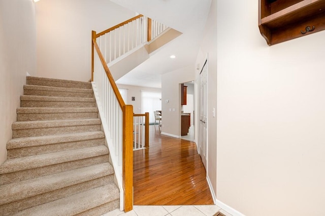 stairway featuring wood-type flooring