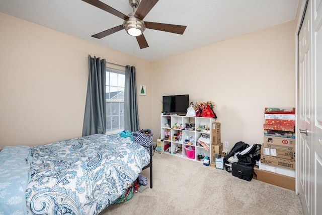 bedroom with carpet flooring, a closet, and ceiling fan