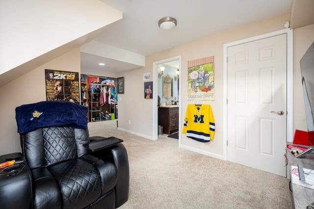 sitting room featuring light colored carpet