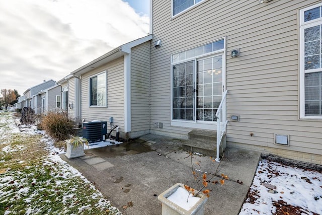 exterior space with cooling unit and a patio area