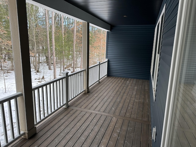 view of snow covered deck