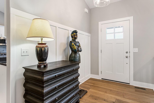 foyer with light hardwood / wood-style floors