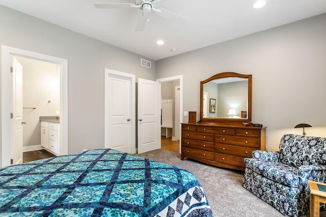 carpeted bedroom with connected bathroom and ceiling fan