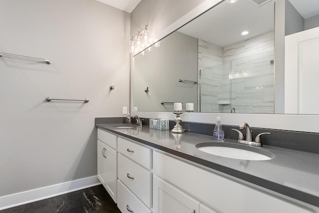 bathroom with an enclosed shower and vanity