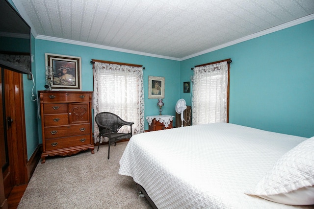 carpeted bedroom featuring crown molding