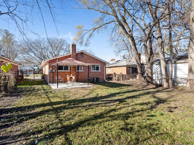 back of property featuring central AC unit, a patio area, and a lawn