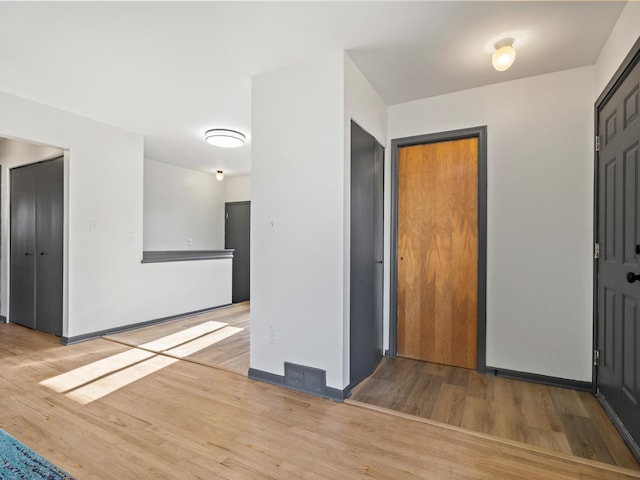 empty room with hardwood / wood-style flooring