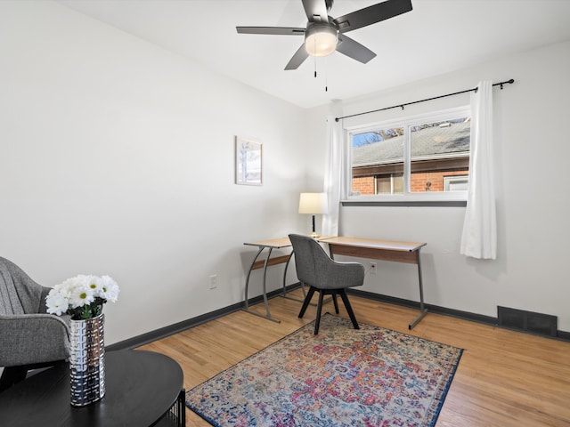 office area featuring light hardwood / wood-style floors and ceiling fan