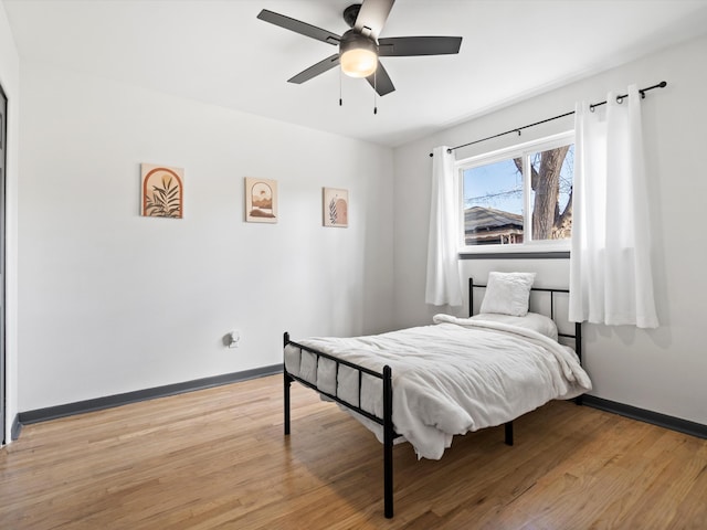 bedroom featuring ceiling fan and light hardwood / wood-style flooring