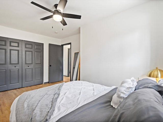 bedroom with ceiling fan and light hardwood / wood-style flooring