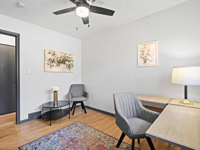 office featuring hardwood / wood-style flooring and ceiling fan