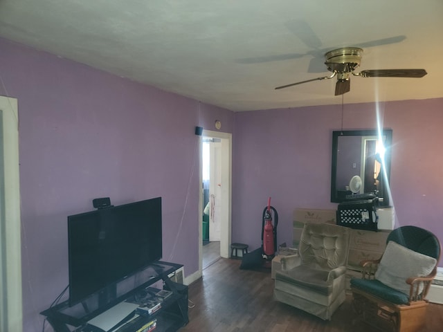 living room with hardwood / wood-style floors and ceiling fan