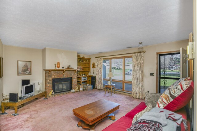 living room with light colored carpet, a textured ceiling, and a brick fireplace