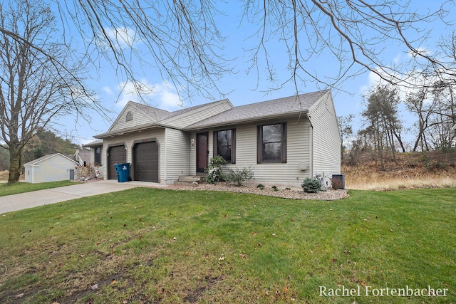 ranch-style home featuring a garage and a front lawn