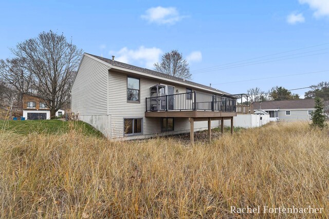 back of property featuring a deck