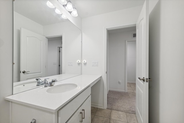 bathroom with tile patterned flooring and vanity