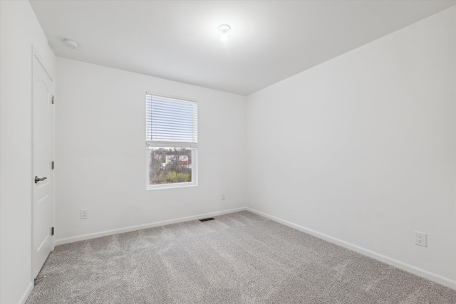 unfurnished room with carpet floors