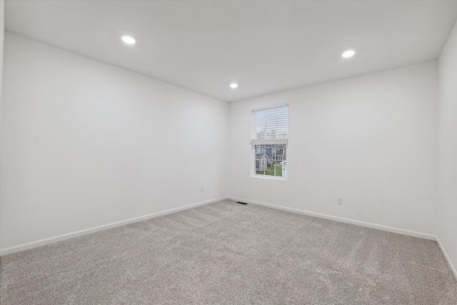 empty room featuring carpet flooring